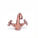 Antique copper vanity faucet – single hole cross handle, front view