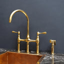 Unlacquered brass 3-hole bridge faucet – close-up of handle design
