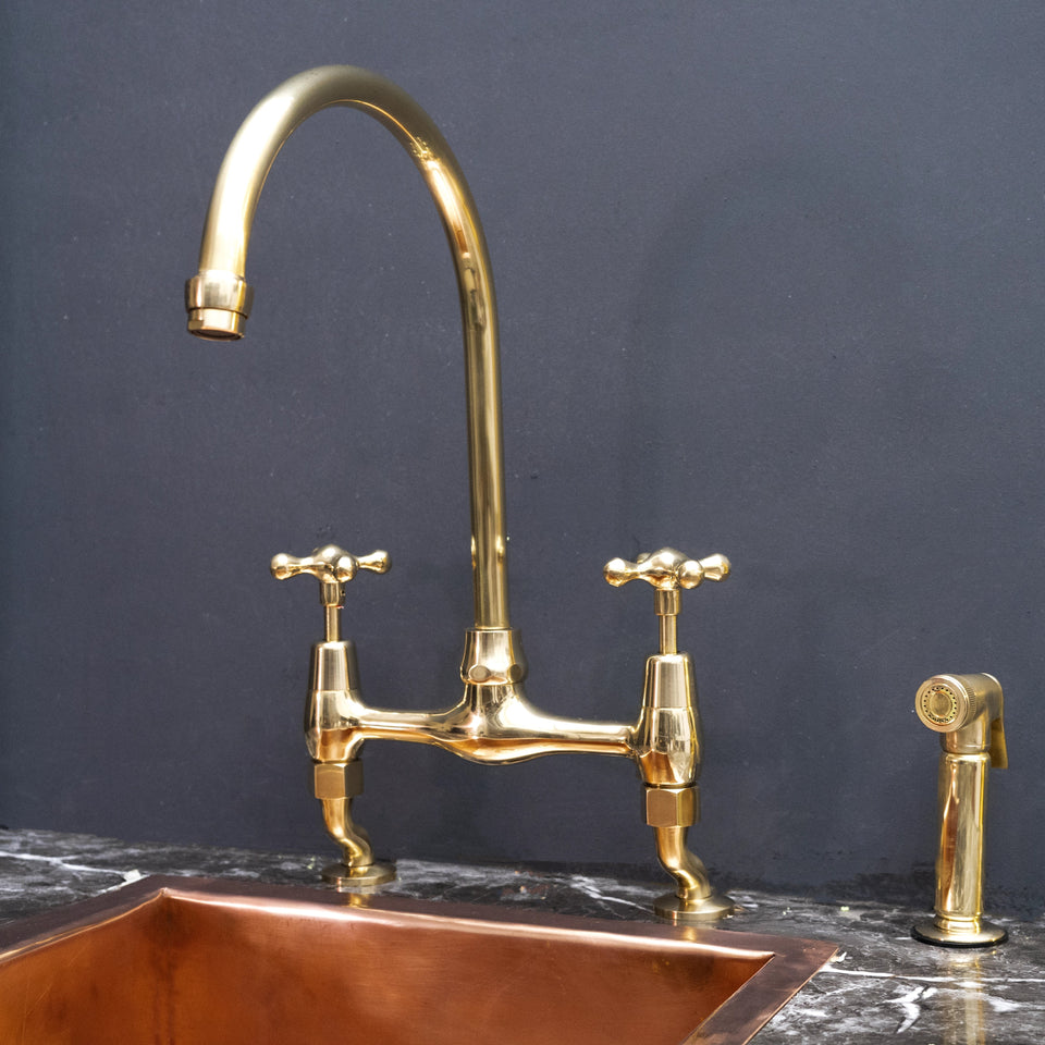 Unlacquered brass curved legs bridge kitchen faucet – elegant proportions, front view