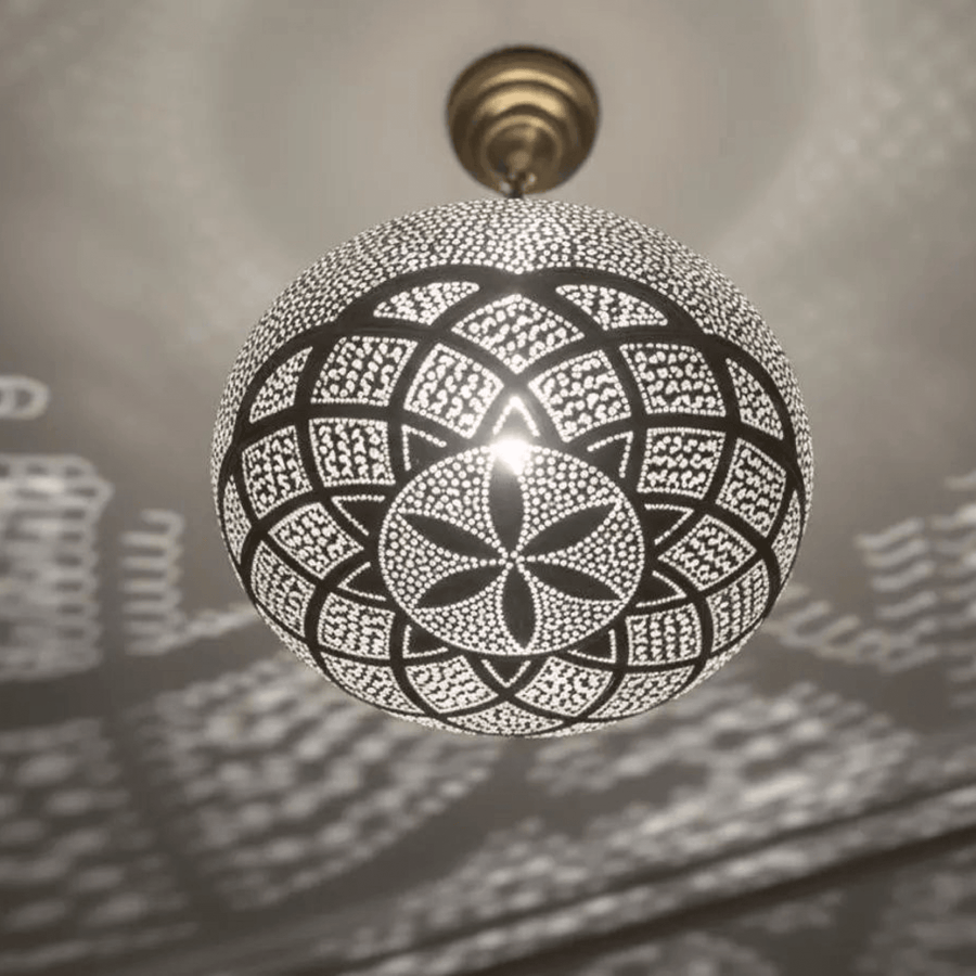 Brass mandala pendant light projecting floral shadow patterns on ceiling – Brass For Homes