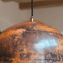 Oxidized copper dome pendant light installed over kitchen island – farmhouse aesthetic – Brass For Homes