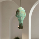 Green patina dome pendant with decorative cutouts illuminated as a lantern — Brass For Homes