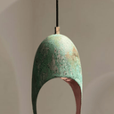 Close-up of green patina copper dome pendant with decorative cutout pattern — Brass For Homes