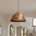 Copper dome pendants in a group of three above wide kitchen island — Brass For Homes