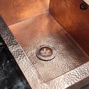 Hammered copper undermount sink – close-up of hand-hammered texture
