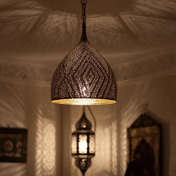 Handcrafted Moroccan brass teardrop pendant light – pierced pattern casting shadows
