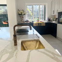 Handcrafted unlacquered brass kitchen sink – side angle showing natural patina