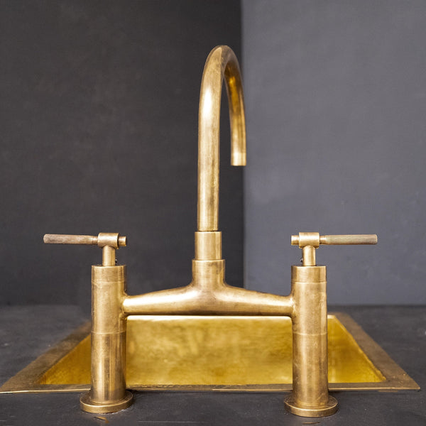 Mykonos unlacquered brass bridge kitchen faucet with sprayer – front view