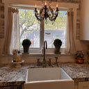 Oil rubbed bronze Victorian bridge faucet – installed in traditional kitchen