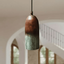 Close-up of tall green patina copper cylinder pendant surface texture — Brass For Homes