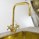 Polished brass bathroom faucet – side view showing lever handle