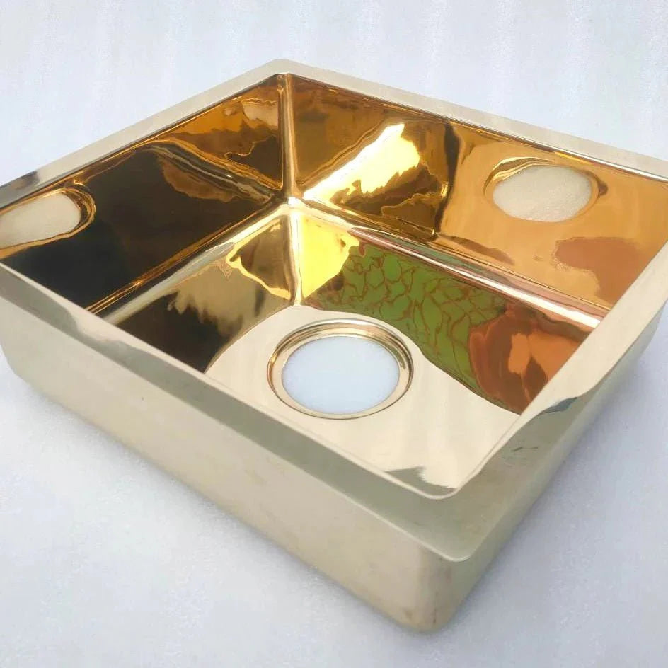 Unlacquered brass single bowl kitchen sink – clean undermount profile, front view